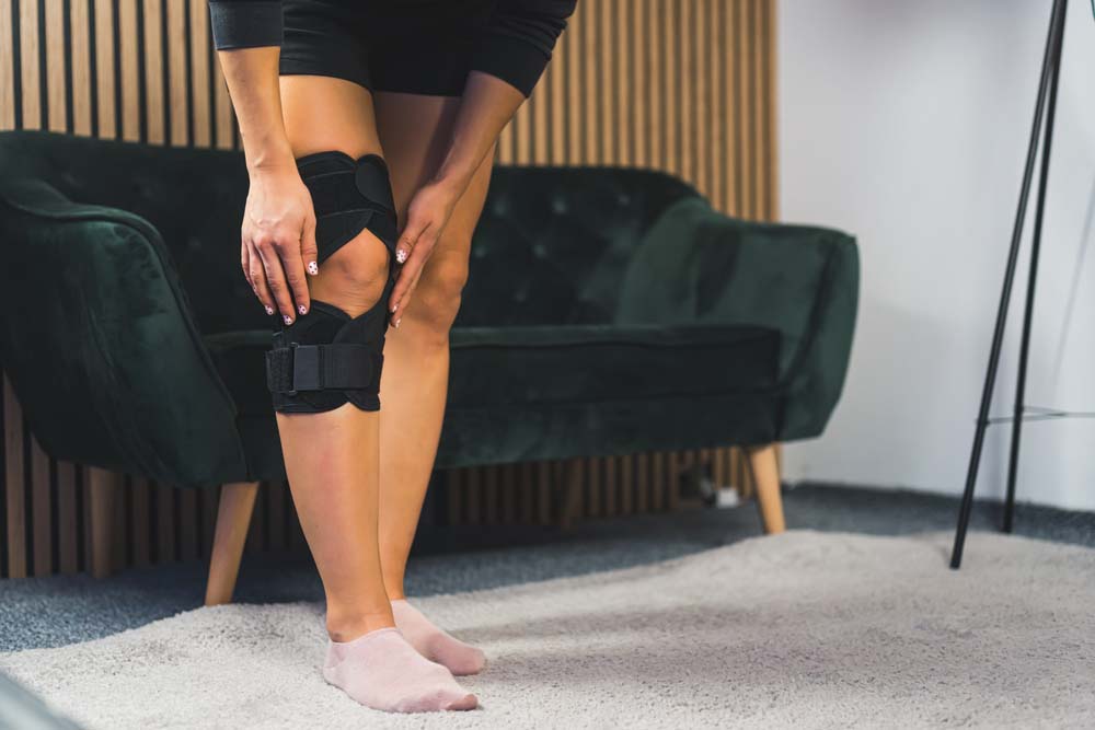 Woman Wearing a Knee Brace